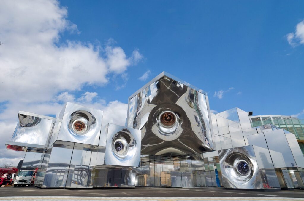 【Expo2025 Osaka】Silver buildings with round openings against a blue sky
