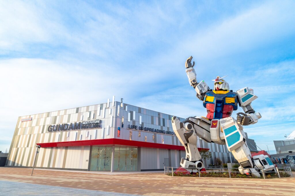 【Expo2025 Osaka】A large robot statue stands in front of a modern building with signs for Gundam Pavilion and Expo 2025
