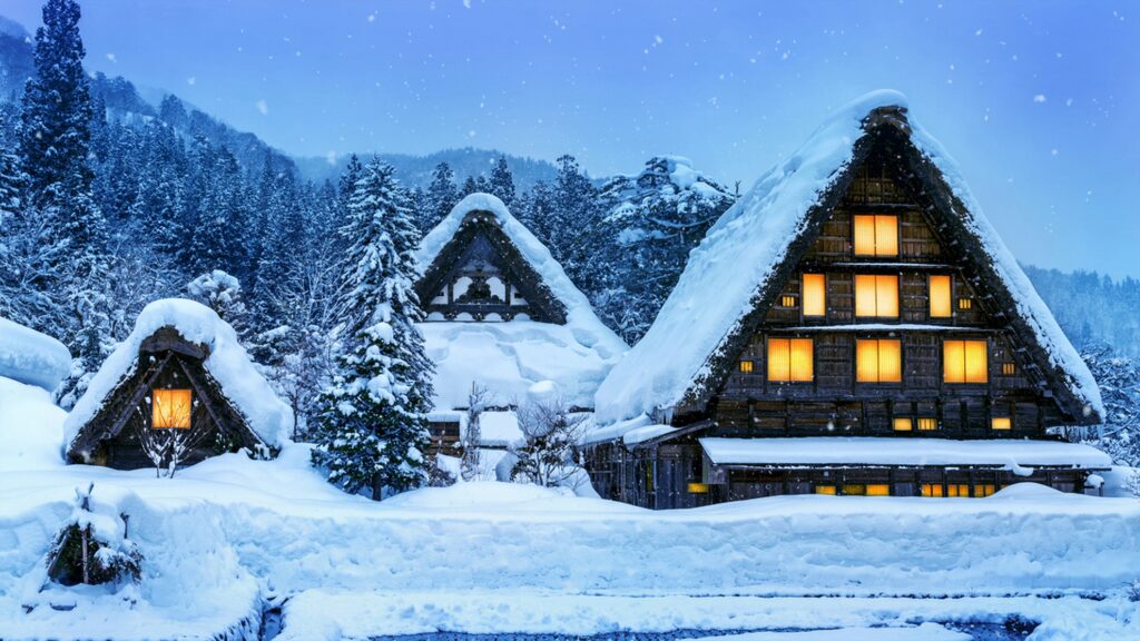 【Shirakawa-go】Traditional gassho-zukuri houses in deep snow at night with glowing windows and falling snow